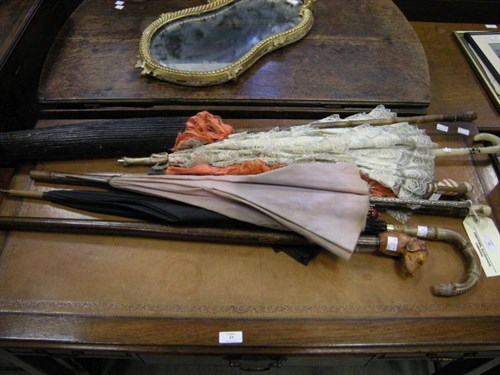 Lot 16 - A quantity of parasols and walking sticks