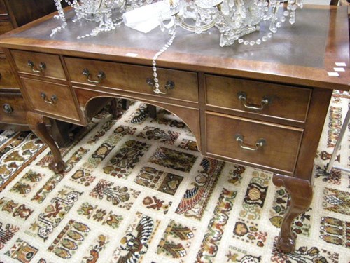 Lot 117 - A reproduction writing desk on cabriole legs