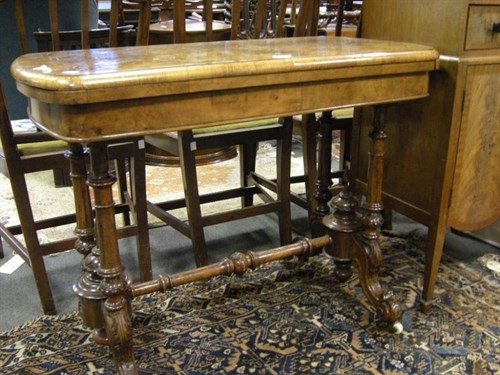 Lot 58 - A walnut veneer inlaid card table
