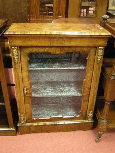 Lot 161 - A walnut pier cabinet