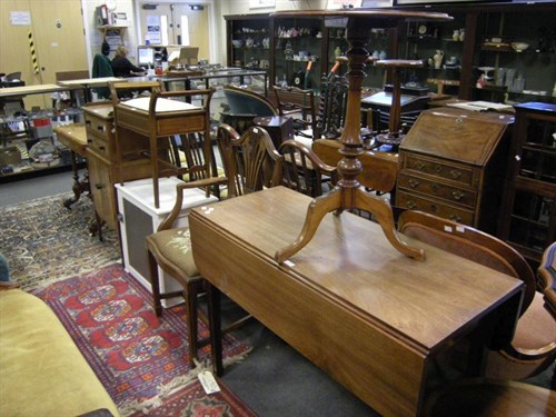 Lot 54 - A mahogany pembroke table and an occasional table