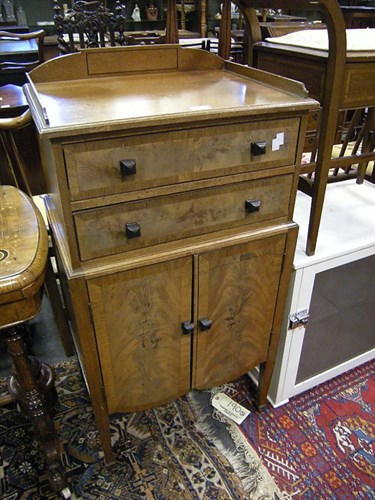 Lot 57 - A Walnut veneer music cabinet