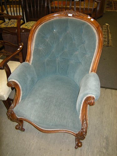 Lot 23 - A Victorian button back armchair