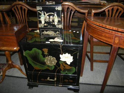 Lot 35 - A Japanese lacquered cabinet and similar table...