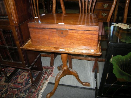 Lot 36 - A mahogany writing box and a tilt top table