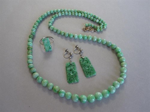 Lot 210 - A pair of carved green jade earpendants and a similar panel ring together with a green bead necklace