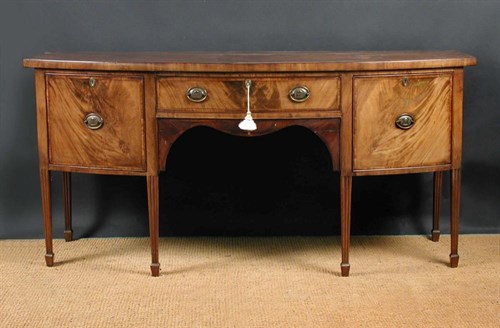 Lot 867 - A George III mahogany bow front sideboard