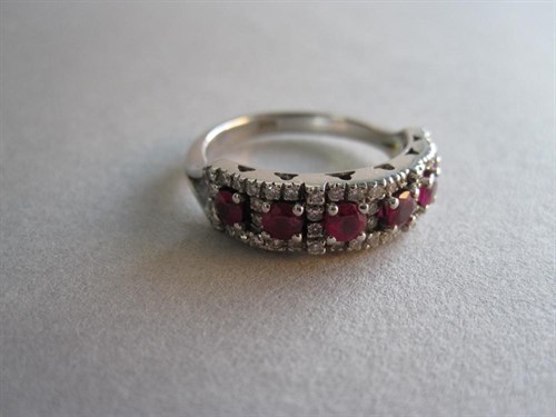 Lot 148 - A half-hoop ruby and diamond ring