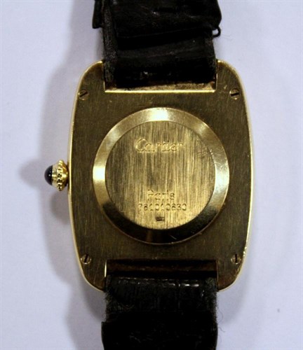 Lot 265 - An 18ct gold Must de Cartier gold tonneau case wristwatch