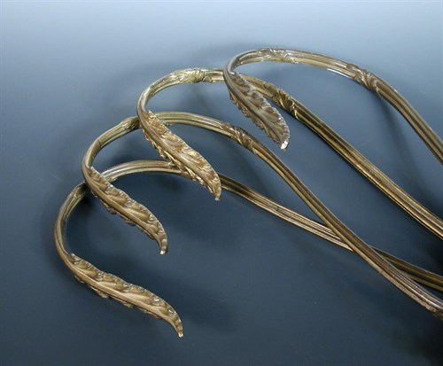 Lot 535 - A set of four late 19th/early 20th century bronze curtain tie backs