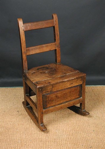 Lot 645 - A small 18th century oak lambing chair, circa...