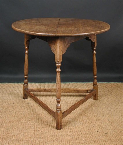 Lot 646 - An 18th century oak cricket table
