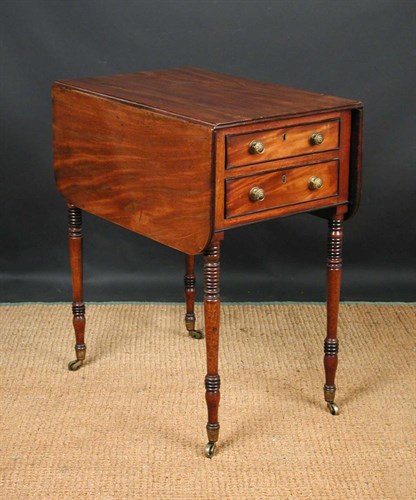 Lot 696 - A George IV mahogany drop leaf work table,...