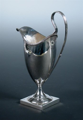 Lot 278 - A George III silver helmet cream jug