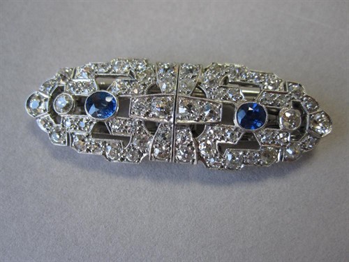 Lot 173 - An Art Deco diamond and sapphire double clip / brooch