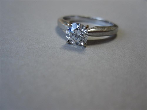 Lot 143 - A single stone diamond ring set in platinum
