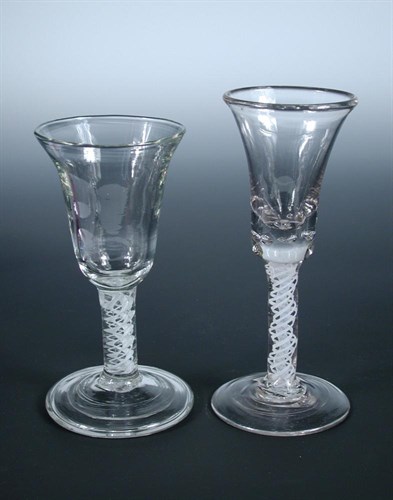 Lot 129 - Two 18th century soda glass opaque double helix twist wines
