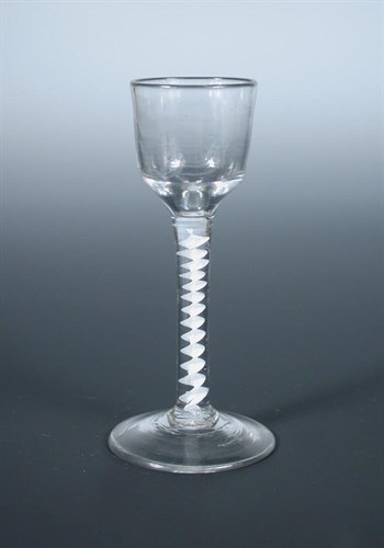 Lot 115 - An 18th century opaque twist wine glass