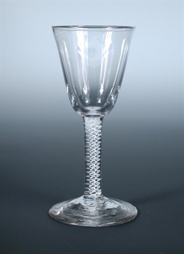 Lot 116 - An 18th century double helix opaque twist wine glass