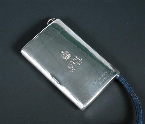 Lot 306 - A silver combination cigarette case and cigar lighter presented by HM King George V