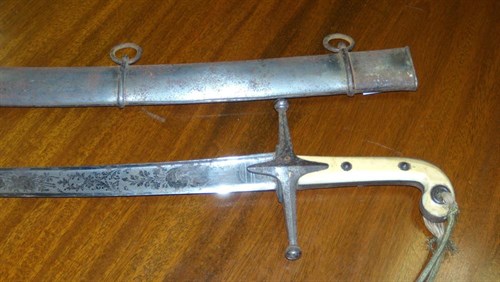 Lot 541 - A 19th century Mameluke handled sabre and iron scabberd