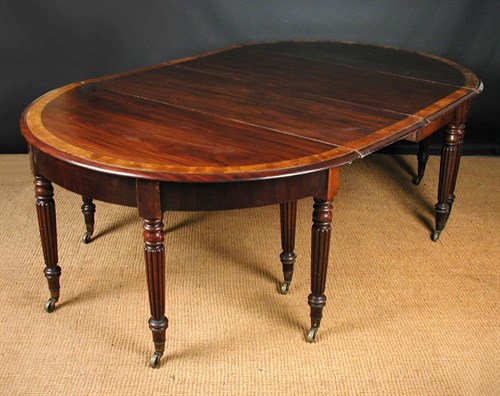 Lot 724 - A 19th century mahogany D-end dining table