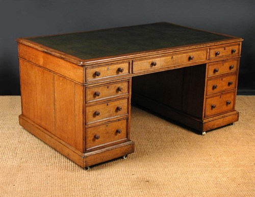 Lot 733 - A Victorian oak twin pedestal partners desk, circa 1860