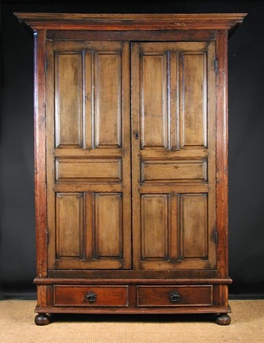 Lot 793A - An 18th century and later French chestnut armoire