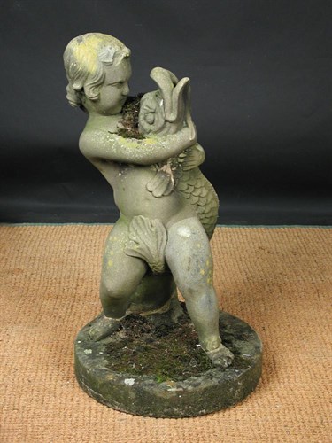 Lot 753 - A composite stone Cherub fountain head