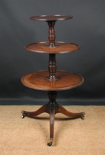Lot 681 - A George III mahogany dumb waiter, circa 1800