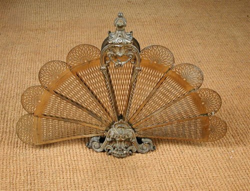 Lot 743 - A Louis XVI revival gilt brass 'fan' fire screen