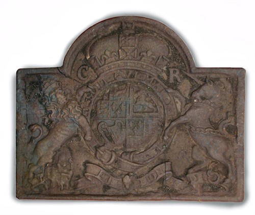 Lot 644 - A cast iron fire back bearing the Arms of Charles II