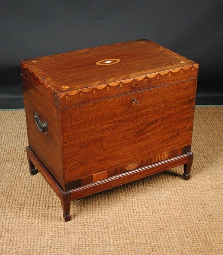 Lot 669 - A George III Sheraton style mahogany cellarette, circa 1800