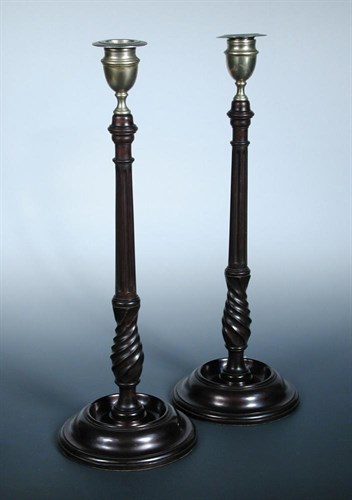 Lot 544 - A pair of mahogany and nickel candlesticks