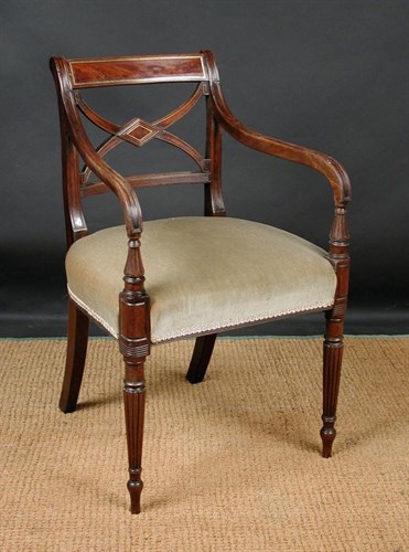 Lot 718 - A Regency brass inlaid elbow dining chair, circa 1820