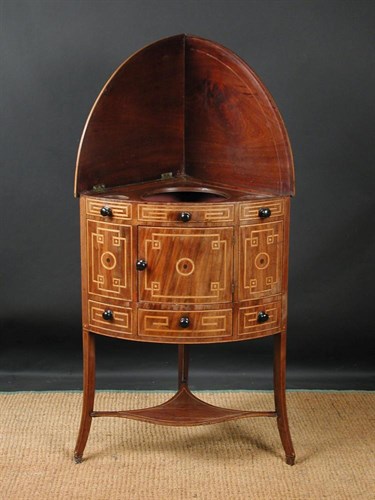 Lot 719 - A Sheraton mahogany corner wash stand