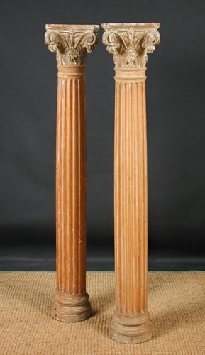 Lot 683 - A pair of carved wood columns with corinthian capitals