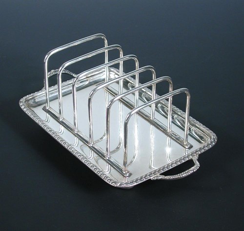 Lot 252 - A silver six bar toast rack