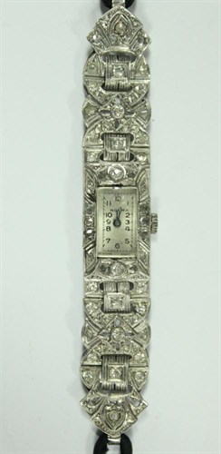 Lot 209 - A platinum and diamond cased lady's cocktail watch