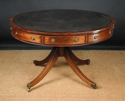 Lot 666 - A Regency revival drum top library table, 20th...