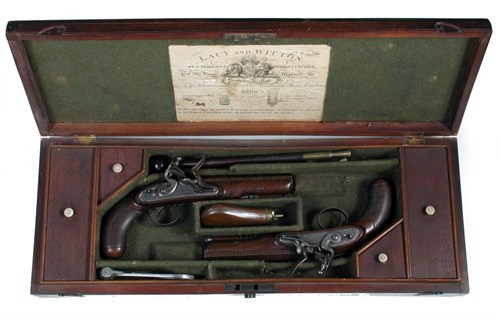 Lot 556 - A fine cased pair of flintlock overcoat pistols by Lacy & Witton, London