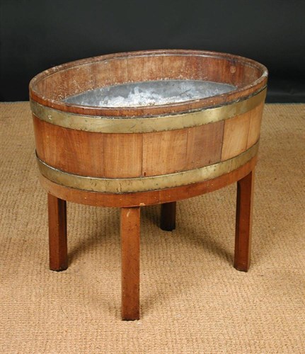 Lot 670 - A George III mahogany wine cooler
