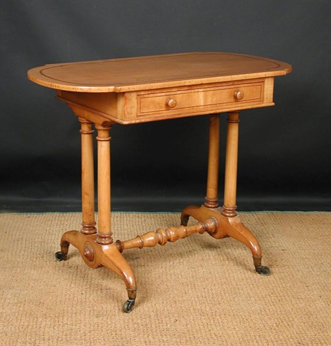 Lot 705 - A Continental satinwood side table with single drawer, circa 1860