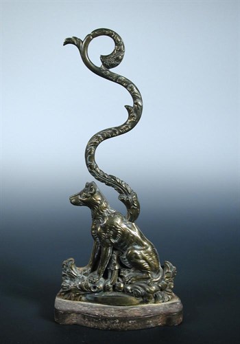 Lot 580 - An early 19th century iron weighted brass door stop