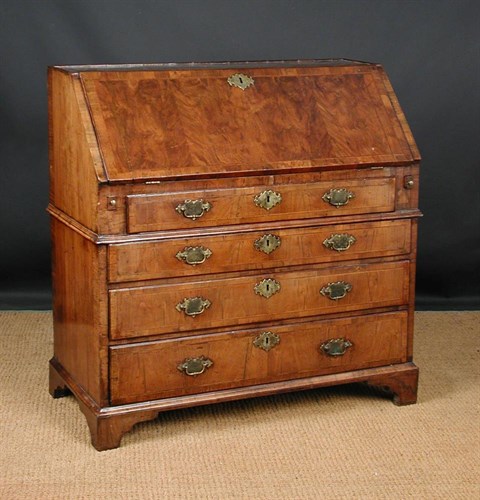 Lot 649 - A George I walnut bureau, circa 1715