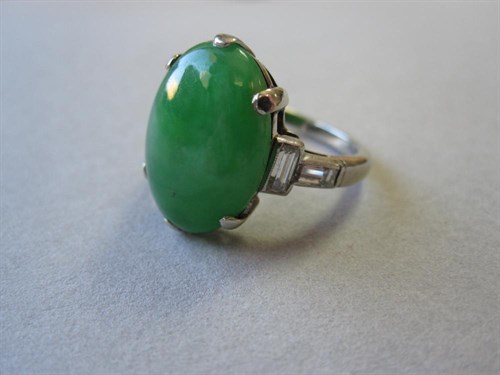 Lot 188 - A jade and diamond ring 