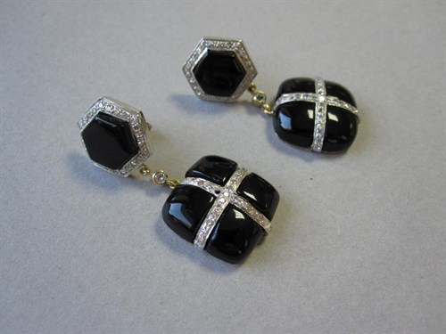 Lot 133 - A pair of 1950's onyx and diamond drop earrings