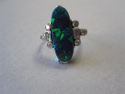 Lot 186 - A black opal and diamond ring