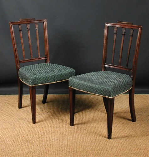 Lot 678 - A pair of George III Sheraton mahogany dining chairs