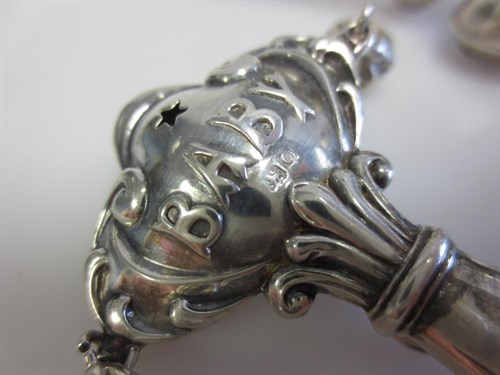 Lot 375 - A Victorian baby's silver whistle, rattle and teether